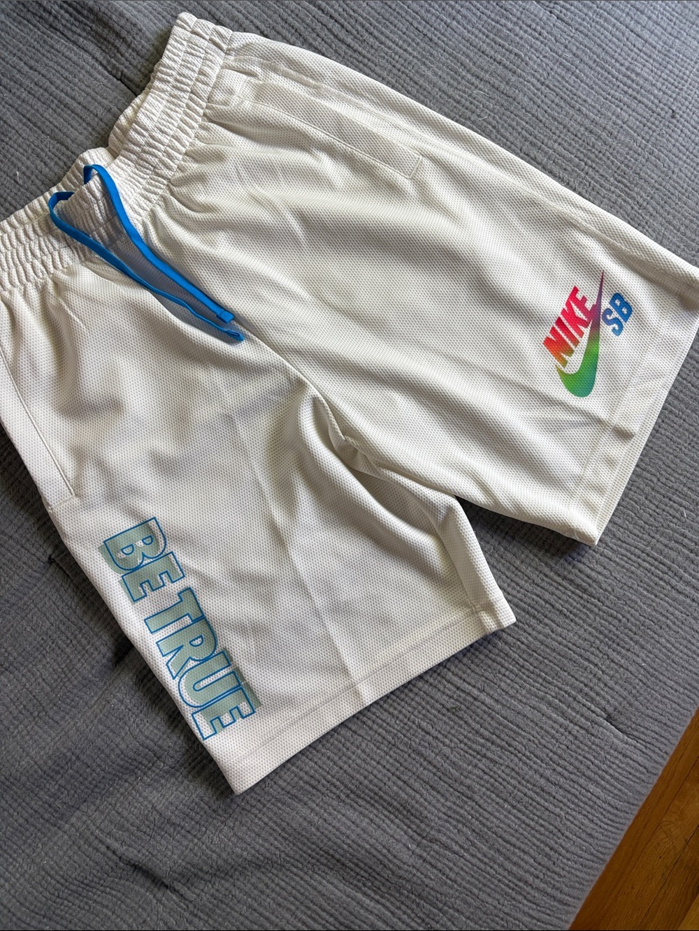 Nike White Men's Athletic Shorts with Blue Drawstring and Rainbow Swoosh
